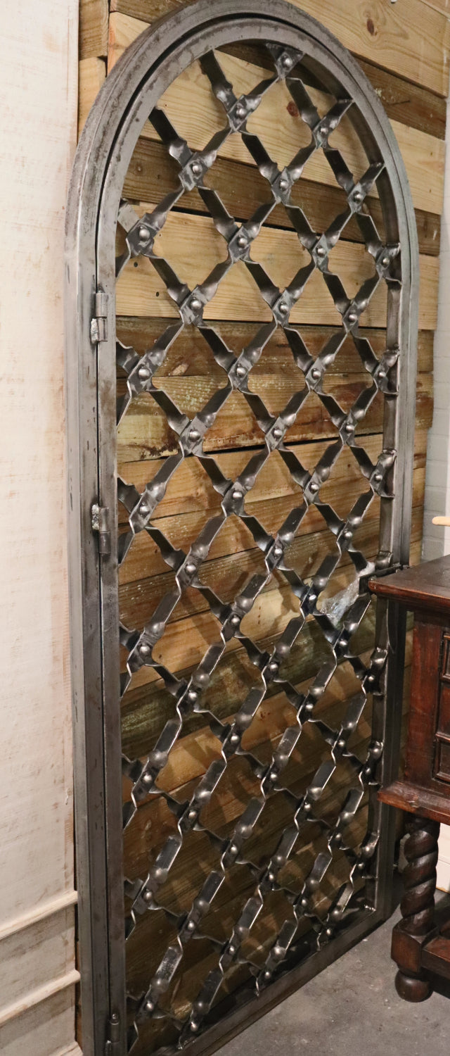 arched iron door with natural finish custom order