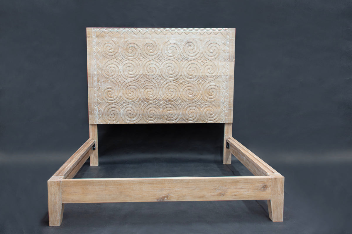 Caracol bed in solid rosewood with whitewash finish and handcarved details.